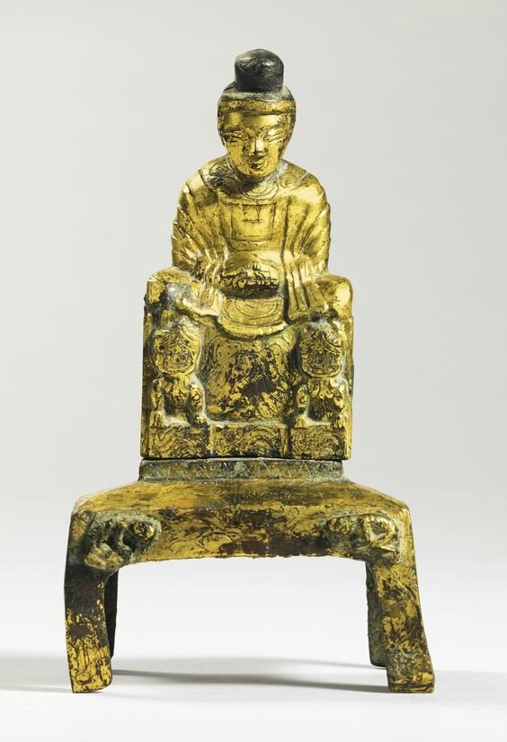 A gilt bronze figure of seated Buddha, China, Sixteen
