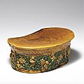 An amber and green-glazed <b>molded</b> <b>pillow</b>, Liao dynasty (907-1125)