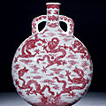 An extremely rare <b>copper</b>-<b>red</b> decorated 'Nine Dragons' moonflask, seal mark and period of Qianlong (1736-1795)