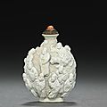 A porcelain snuff bottle with eighteen <b>luohan</b>, Jiaqing period