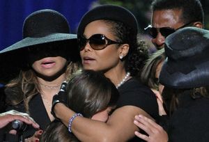 1-paris-jackson-is-embraced-by-family-members-after-speaking-at-memorial-service-for-michael-jackson-at-the-staples-center-in-los-angeles_