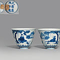 A pair of unusual blue and white 'scholar and pine' <b>wine</b> <b>cups</b>, Kangxi six-character marks in underglaze blue and of the period