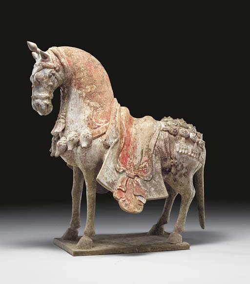 A painted well-modelled pottery figure of a caparisoned horse, Eastern Wei dynasty (534-550)