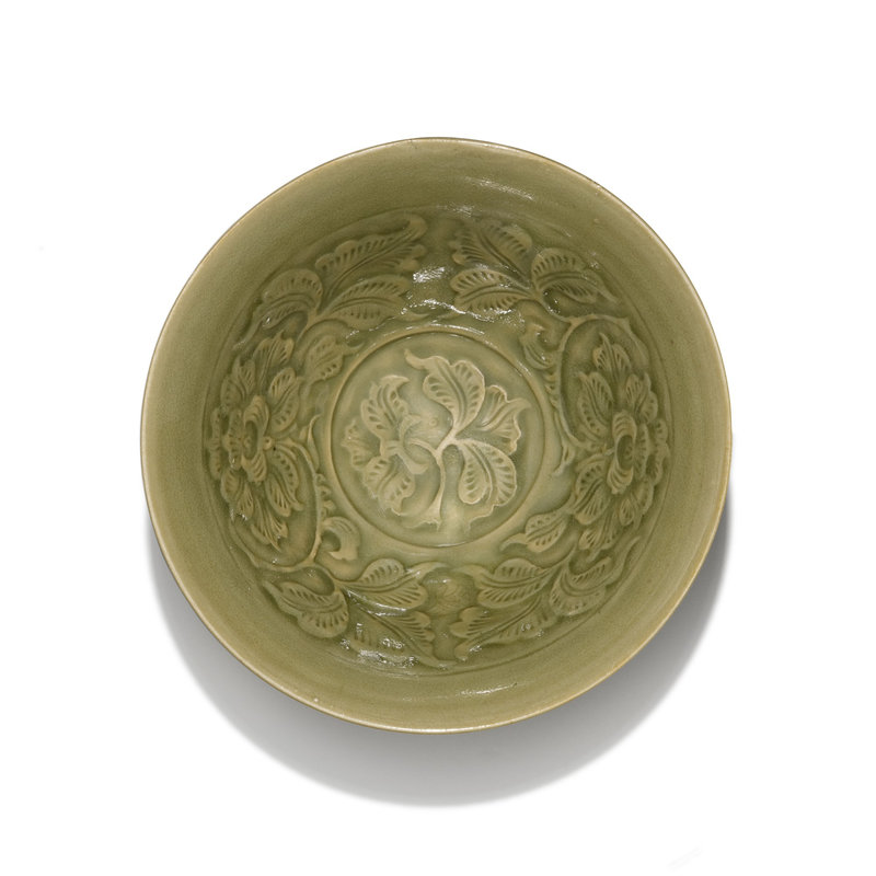 A Yaozhou carved and moulded 'peony and small bird' bowl, Northern Song dynasty (2)