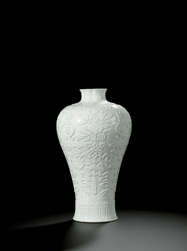 A rare white-glazed relief-carved vase, meiping, Qing dynasty, Qianlong period (1736-1795)