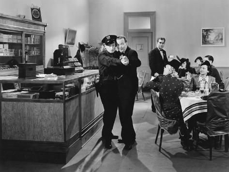 Policeman and a Man Dancing a Tango in a Restaurant' Photo