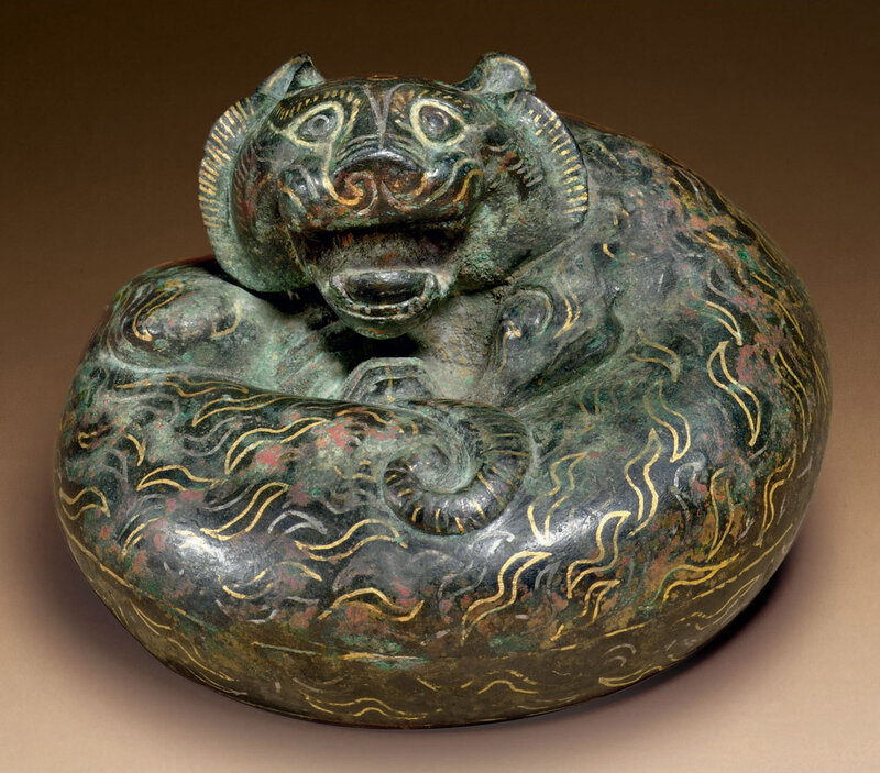 2010_NYR_02508_0886_000(a_rare_gold_and_silver-inlaid_bronze_tiger-form_weight_eastern_han_dyn)