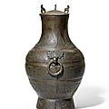 A rare <b>archaic</b> <b>bronze</b> <b>wine</b> <b>vessel</b> and cover, hu, Warring States Period
