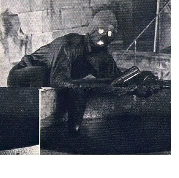 Fantomas_crawling_out_of_wine_cellar