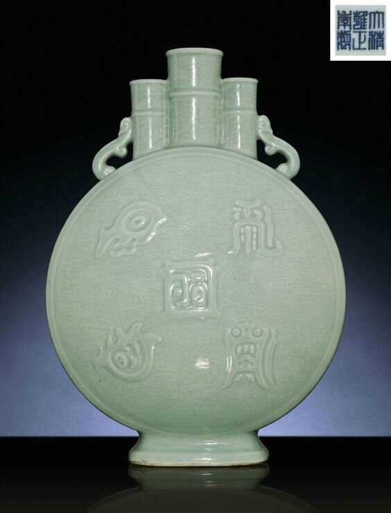 A superb large celadon-glazed triple-neck moonflask, Yongzheng six-character sealmark and of the period (1723-1735)