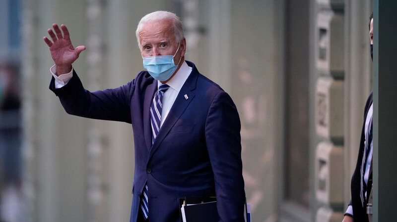 Joe Biden president behing a mask