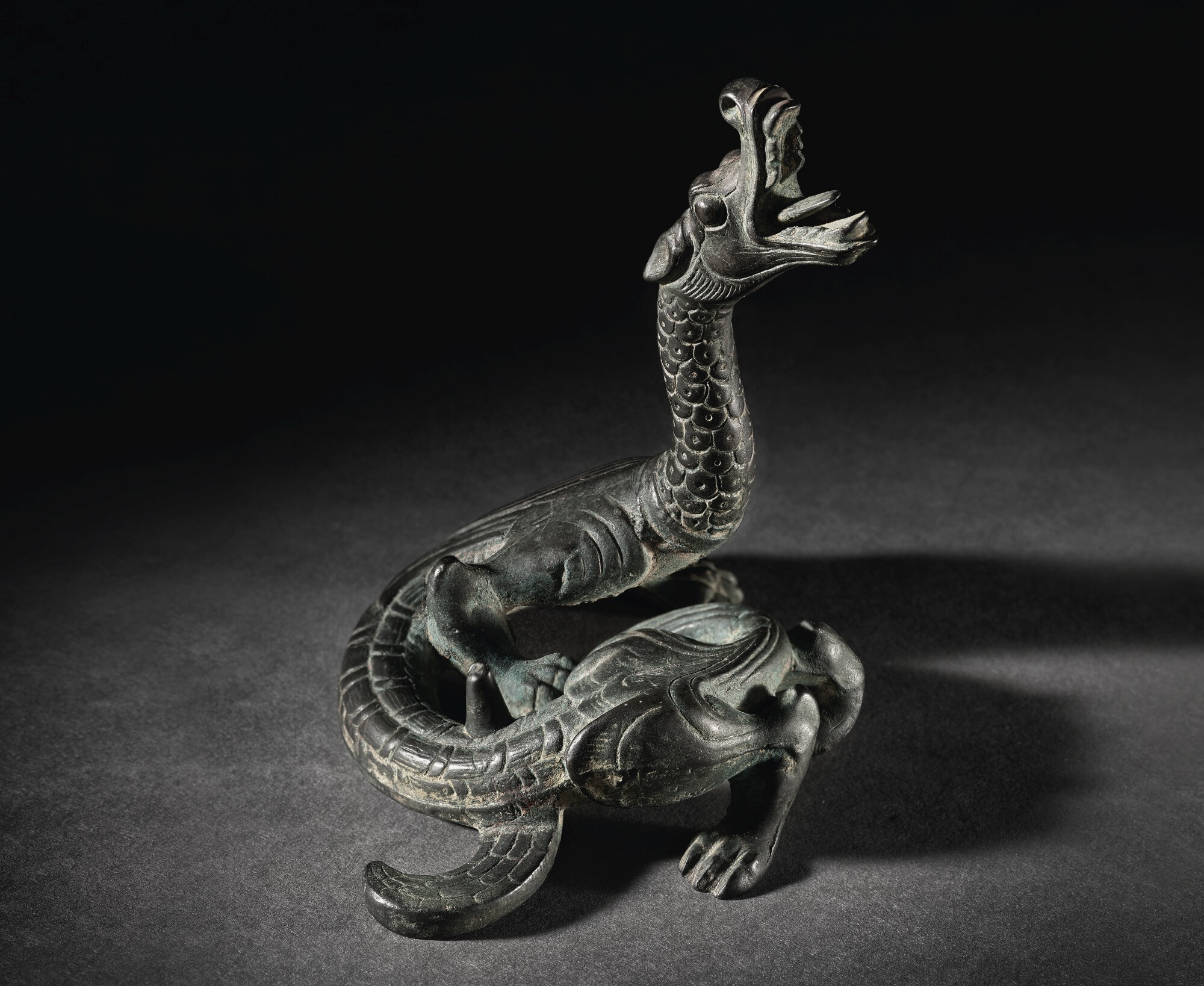 An exceptionally rare bronze dragon-form support, Han An exceptionally rare bronze dragon-form support, Han