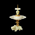 A rare documented imperial gilt bronze-decorated white jade <b>candlestick</b>, Seal mark and period of Qianlong