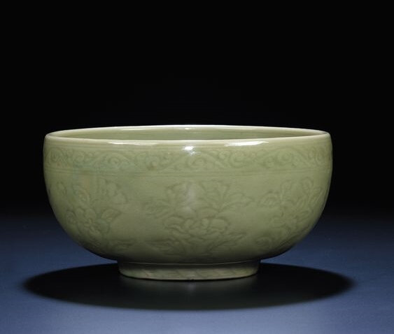 A fine and very rare carved early Ming Longquan celadon deep bowl, Ming dynasty, 15th century