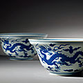 A pair of blue and white ogee-shaped '<b>dragon</b>' <b>bowls</b>, Qianlong seal marks and of the period (1736-1795)