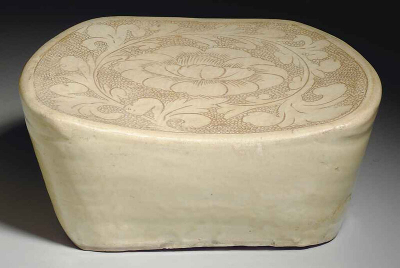 A Cizhou ivory-glazed carved pottery pillow, Song dynasty, 11th-12th century