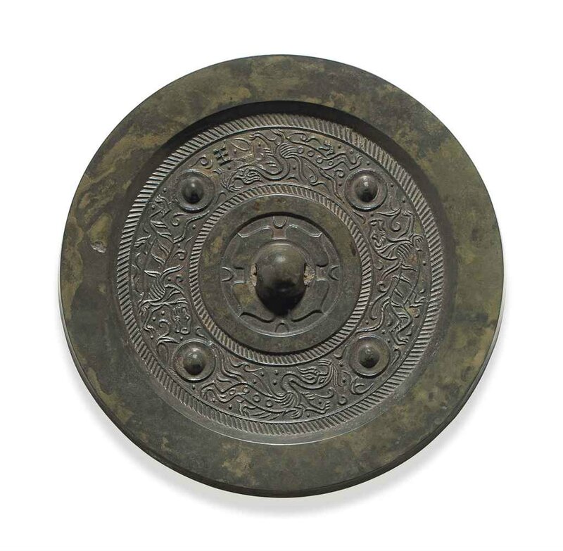 A bronze circular mirror with animals, Western Han dynasty (206 BC-AD 8)   