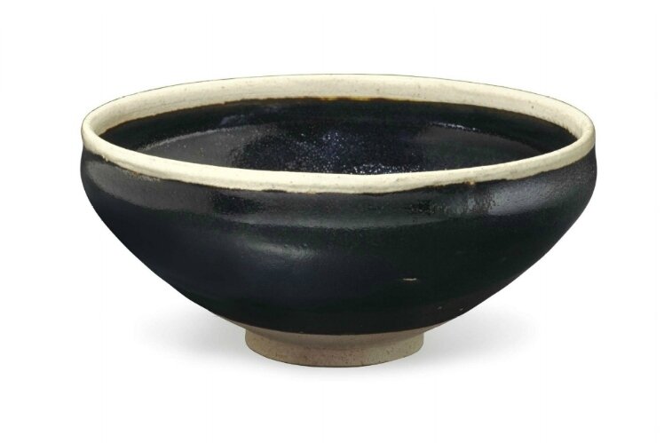 A Cizhou-type blackish-brown-glazed bowl with white rim, China, Jin dynasty, 12th-13th century