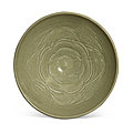 A large carved '<b>Yaozhou</b>' celadon-glazed 'floral' bowl, Northern Song dynasty