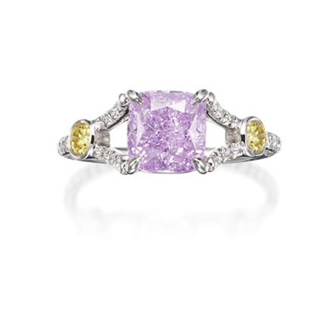 An extremely rare fancy coloured diamond and diamond ring