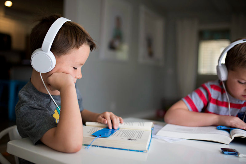 Boy-reading-with-audiobook-headphones-1024x683