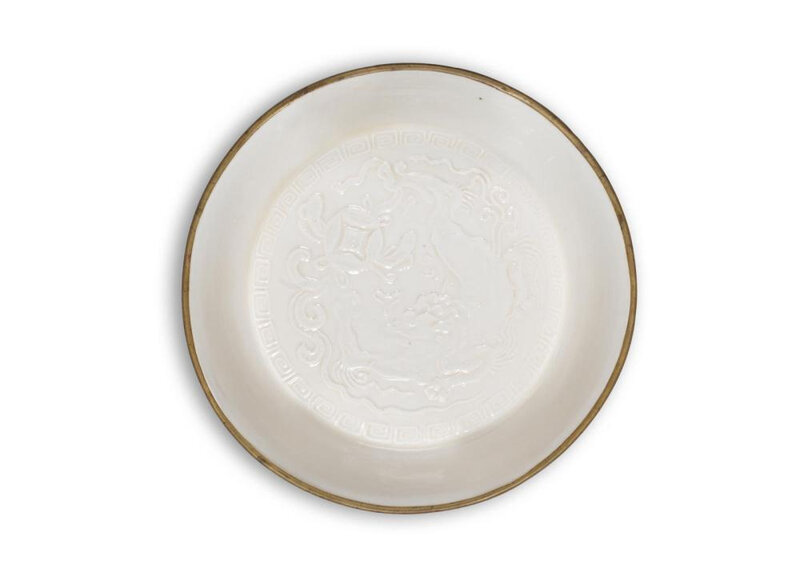A rare Dingyao moulded 'Buddhist Lion' dish, Song-Jin dynasty (960-1234)