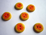 boutons_pompon_orange_sur_jaune