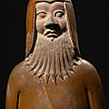 A rare <b>olive</b>-glazed pottery figure of a soldier, Sui Dynasty (589-618 AD)