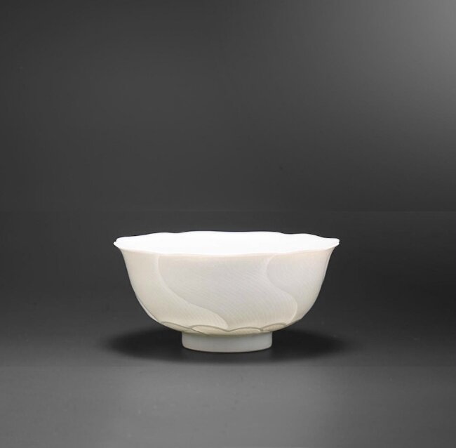 An anhua-incised white-glazed 'lotus' cup, Yongzheng six-character mark and of the period (1723-1735)