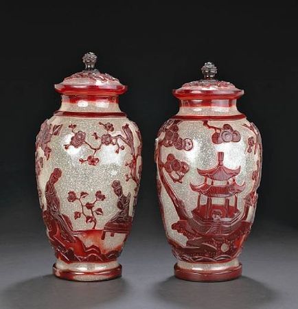 A_pair_of_red_overlay_glass_covered_jars