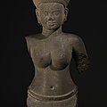 A sandstone bust of a female divinity, Cambodia, <b>Angkor</b> Period, style of Pre Rup, 10th century