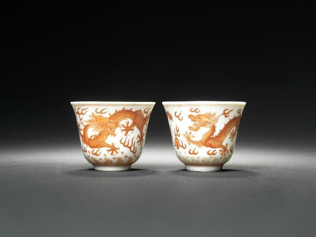 A pair of iron-red 'dragon' wine cups Guangxu six-character marks and of the period