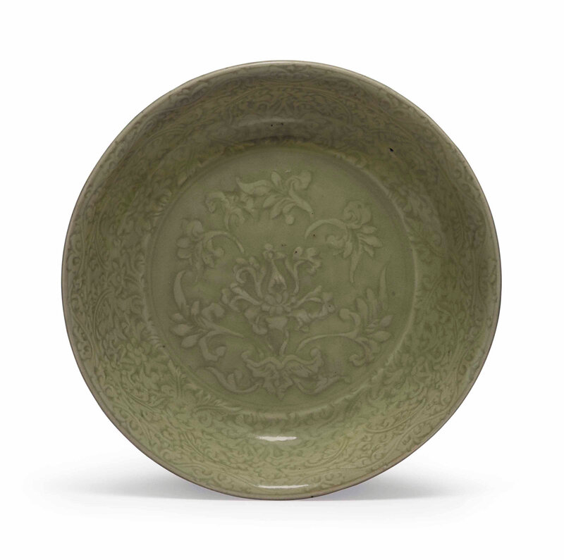 A rare finely carved Longquan celadon dish, Ming dynasty, 15th century
