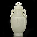 A fine very pale green jade <b>archaistic</b> <b>vase</b> and cover, Qianlong period