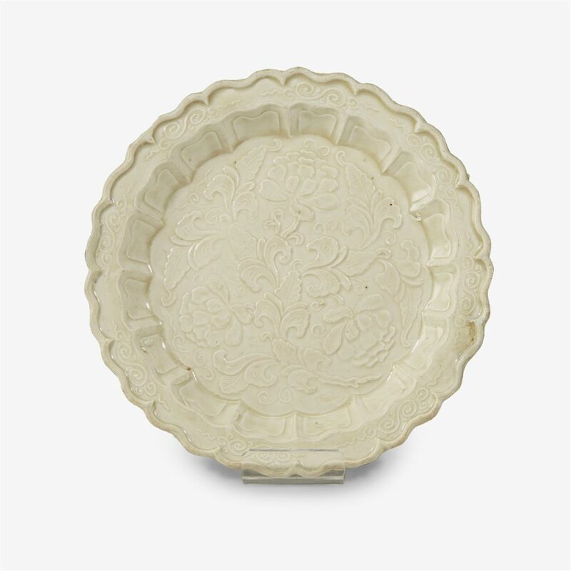 A Chinese moulded 'Ding' 'peony' dish, Northern Song dynasty (960–1127)