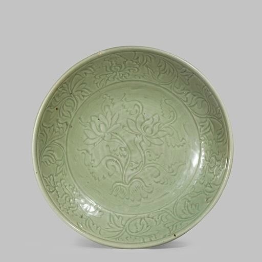 A massive Chinese Longquan celadon dish, Yuan-Early Ming dynasty