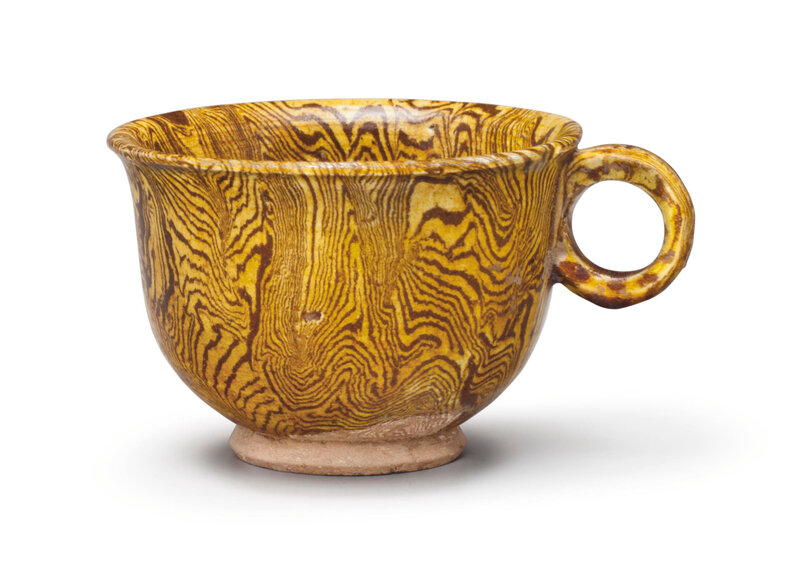 An amber-glazed marbled pottery cup, Tang dynasty (618-907)