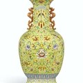 A magnificent <b>yellow</b>-<b>ground</b> famille-rose 'Anbaxian' sgraffiato vase with dragon handles, seal mark and period of Qianlong