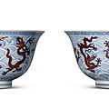 A rare pair of large <b>iron</b>-<b>red</b> <b>and</b> <b>underglaze</b> <b>blue</b> ‘dragon’ deep bowls, Kangxi marks <b>and</b> period (1662-1722)