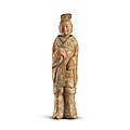 A painted <b>pottery</b> figure of a standing official, Northern Wei dynasty (386-535)