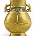 An extremely rare gold and silver-decorated 'bronze-imitation' <b>archaistic</b> <b>vase</b>, zun, Seal mark and period of Qianlong