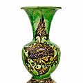 A rare <b>Cizhou</b> green-glazed and iron-black-brown-painted and incised 'peony' baluster vase, Northern Song-Jin Dynasty, 12th Centu