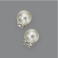 Pair of natural button pearl and <b>diamond</b> <b>earclips</b>, Cartier, French, circa 1930