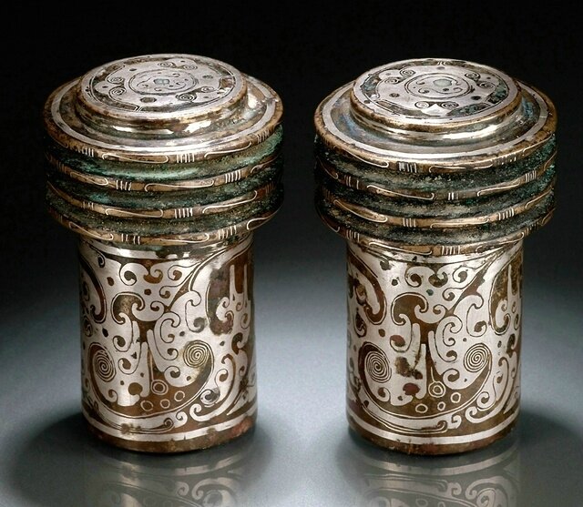 A pair of silver inlaid bronze chariot fittings, probably Western Han dynasty, 1st century BC