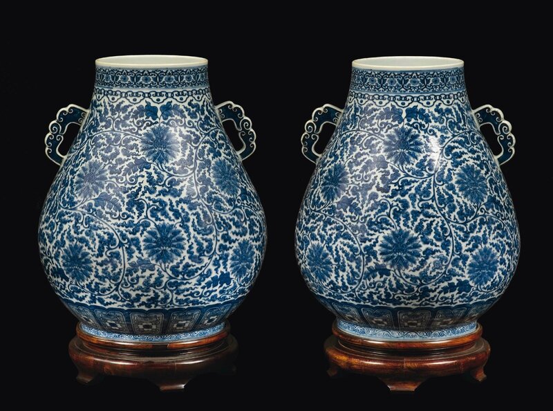 A pair of blue and white double handled vases with floral decoration, China, Qing Dynasty, 19th century