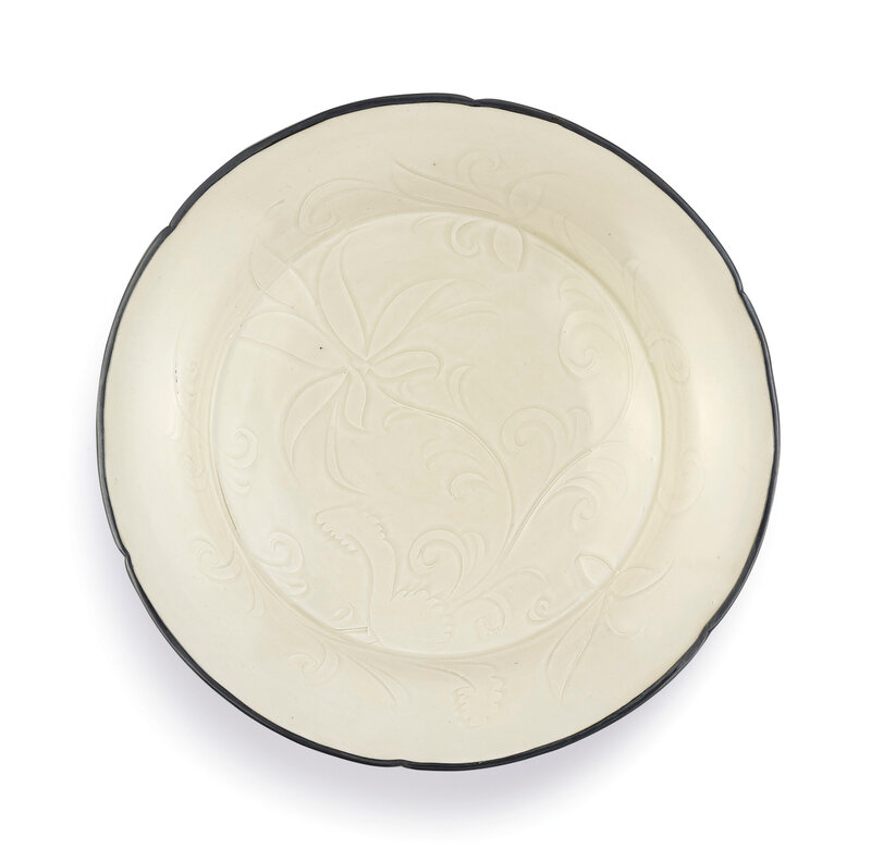 A carved lobed Dingyao 'Lotus' dish, Northern Song dynasty (960-1127)