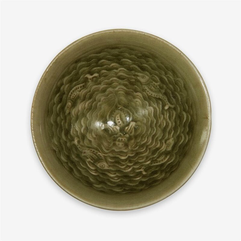 A small Chinese moulded 'Yaozhou' celadon glazed 'four fishes' bowl, Northern Song dynasty (960–1127)