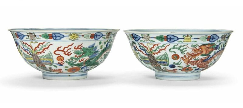 A pair of wucai 'dragon and phoenix' bowls, Qianlong six-character seal marks in underglaze blue and of the period (1736-1795)