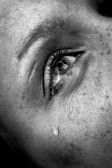 1877453-crying-woman-s-eye-black-and-white-image-low-key-selective-focus