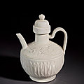 A superb and very rare carved white ware <b>ewer</b> and cover, Liao dynasty (AD 916-1125)